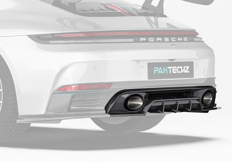 A full-width rear image of a Porsche 911 992.2 highlighting the sleek integration of the Carbon Fiber Lower Rear Diffuser