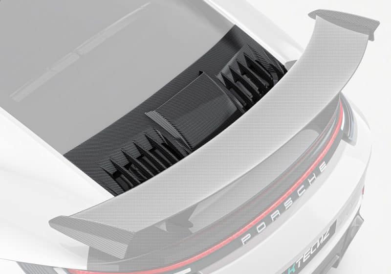 A rear view showcasing the Carbon Fiber Rear Engine Lid perfectly integrated into the Porsche 992 Turbo S, emphasizing its sleek design and refined contours