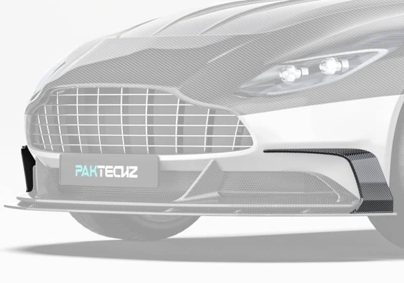 Aston Martin DB11’s front-end featuring the installed carbon fiber front canards, emphasizing the aerodynamic accents and bold styling