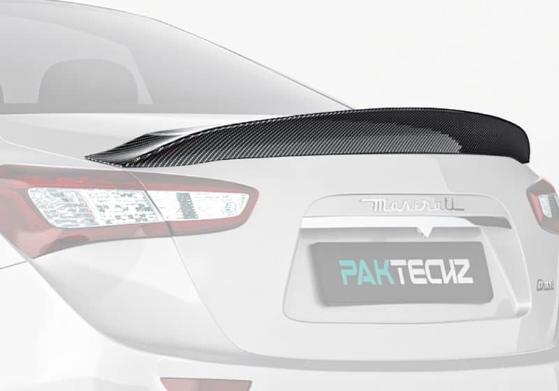 A stunning full-rear view of the Maserati Ghibli featuring the Carbon Fiber Rear Spoiler, accentuating the luxury sports design